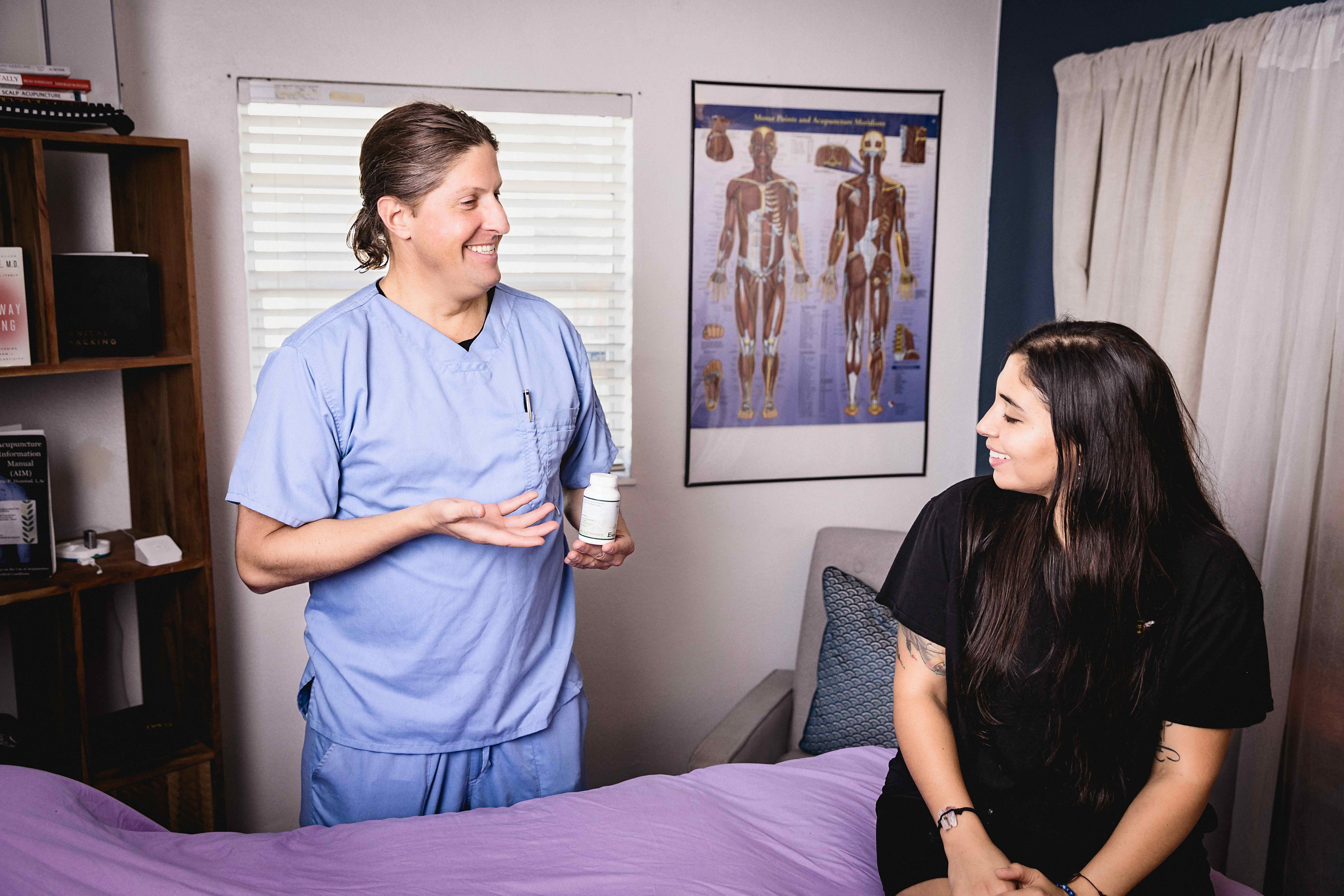 Dr. Jon Kukor discussing perimenopause herbal treatment with patient at Orlando Alternative Health Winter Park