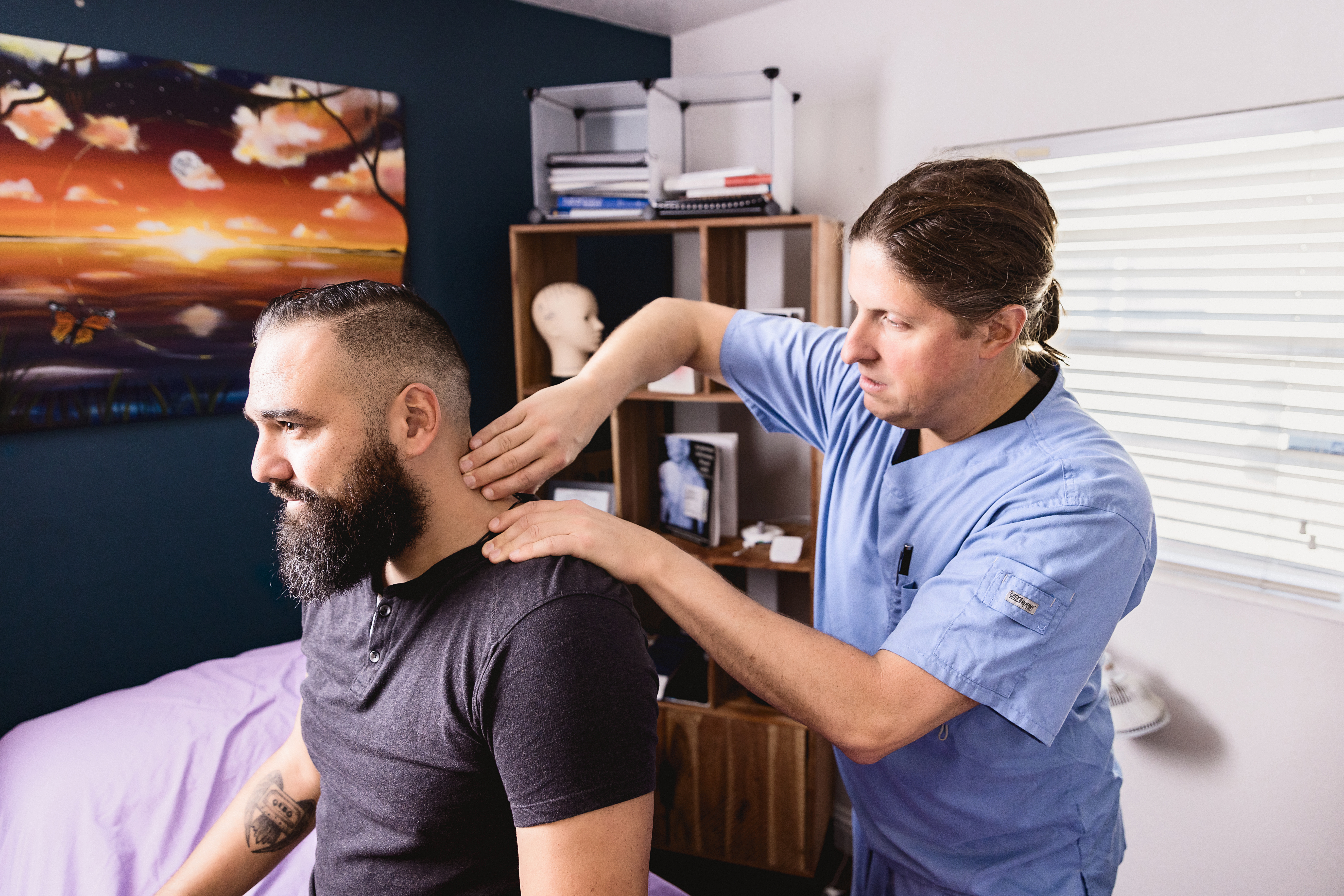 Dr. Jon Kukor performing dry needling treatment for neck and shoulder pain at Orlando Alternative Health serving Orlando FL